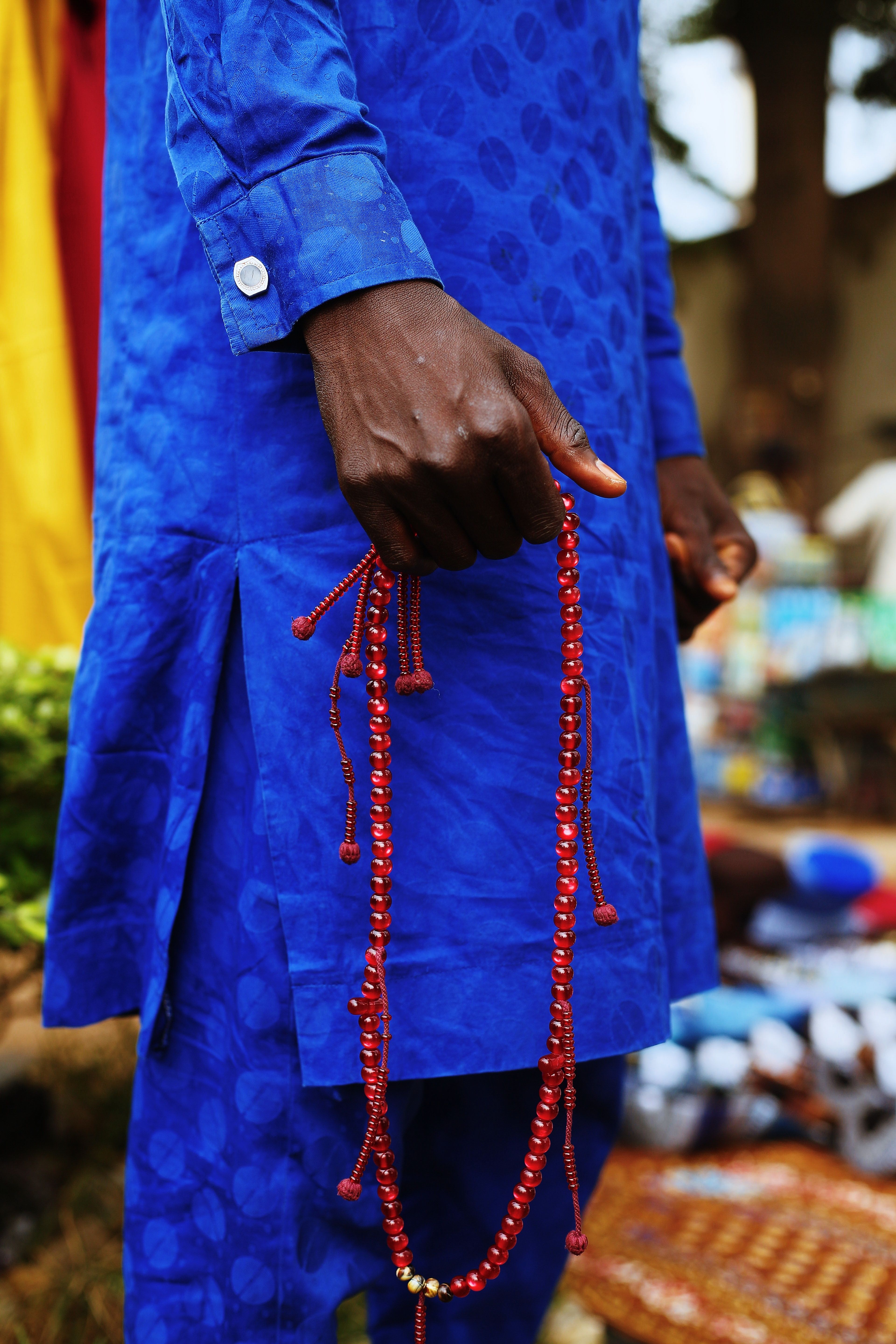 Man in Traditional Dress with Prayer Beads in Abuja · Free Stock Photo