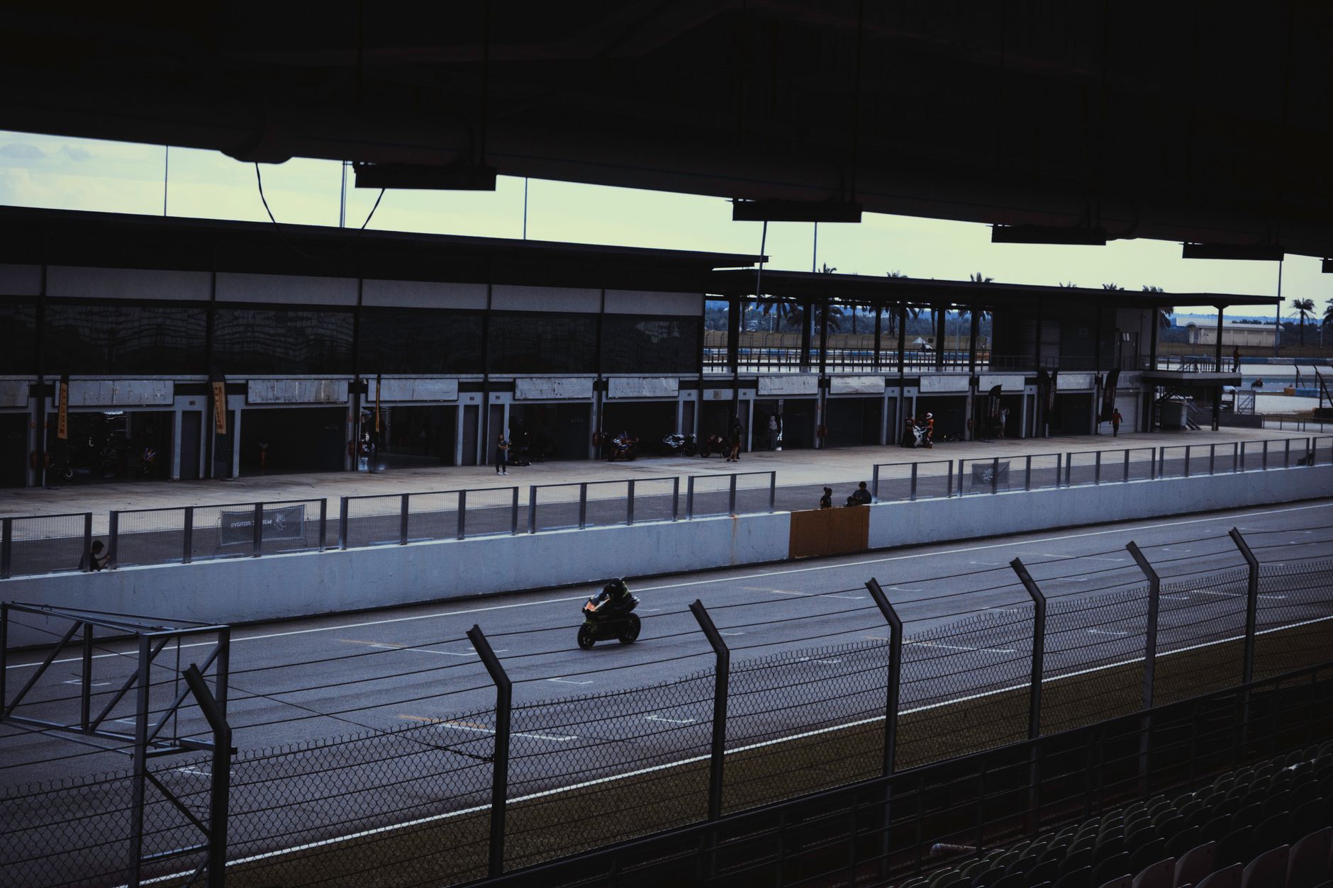 A thrilling motorcycle race on a track in Sepang, Malaysia. Perfect for motorsport enthusiasts.