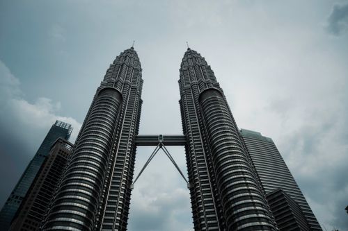 Free Stunning view of Petronas Towers against a moody sky in Kuala Lumpur, Malaysia. Stock Photo