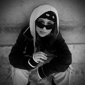 Black and white portrait of a young woman in street style captured in Zaragoza.