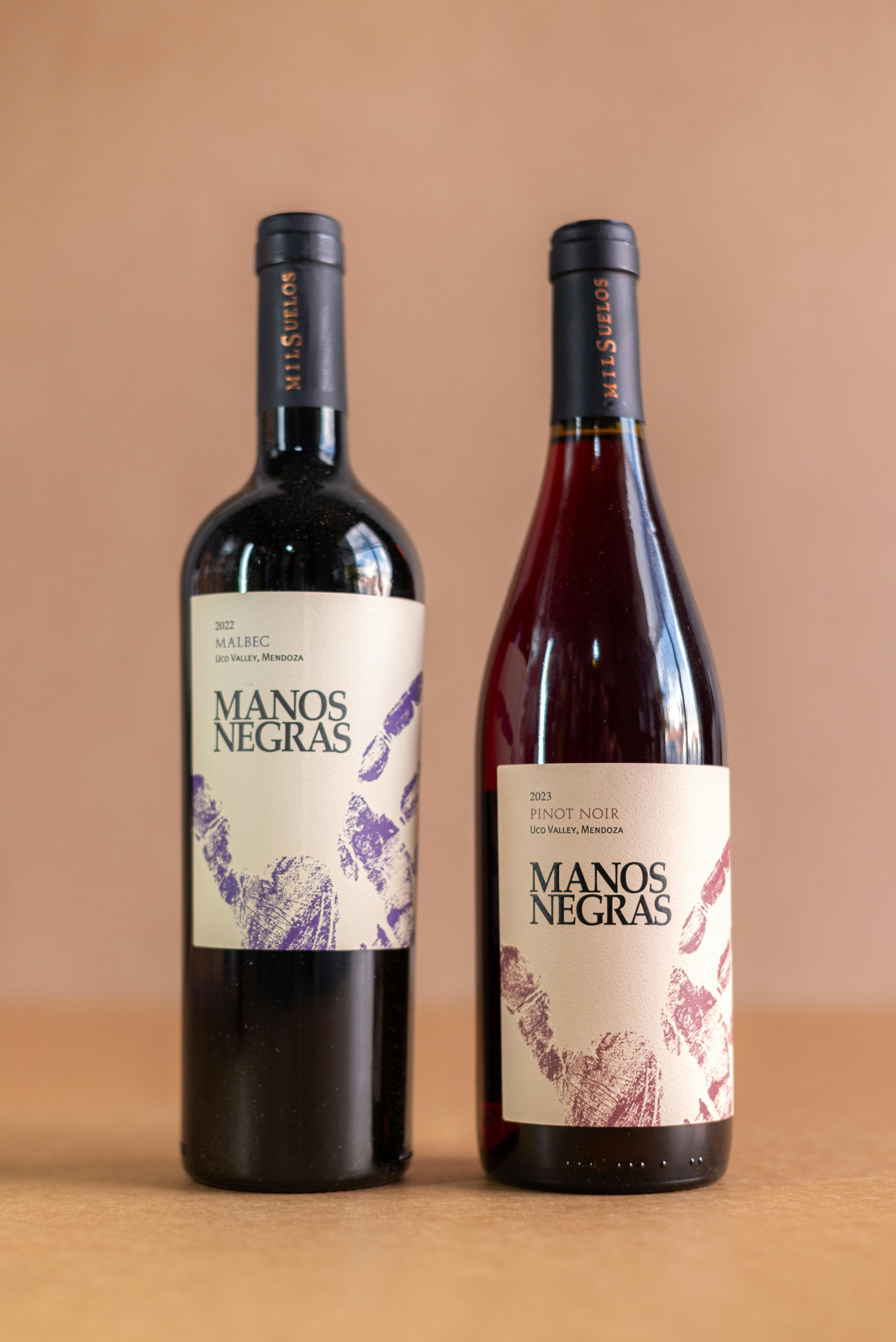 Elegant Manos Negras wine bottles captured with studio lighting.