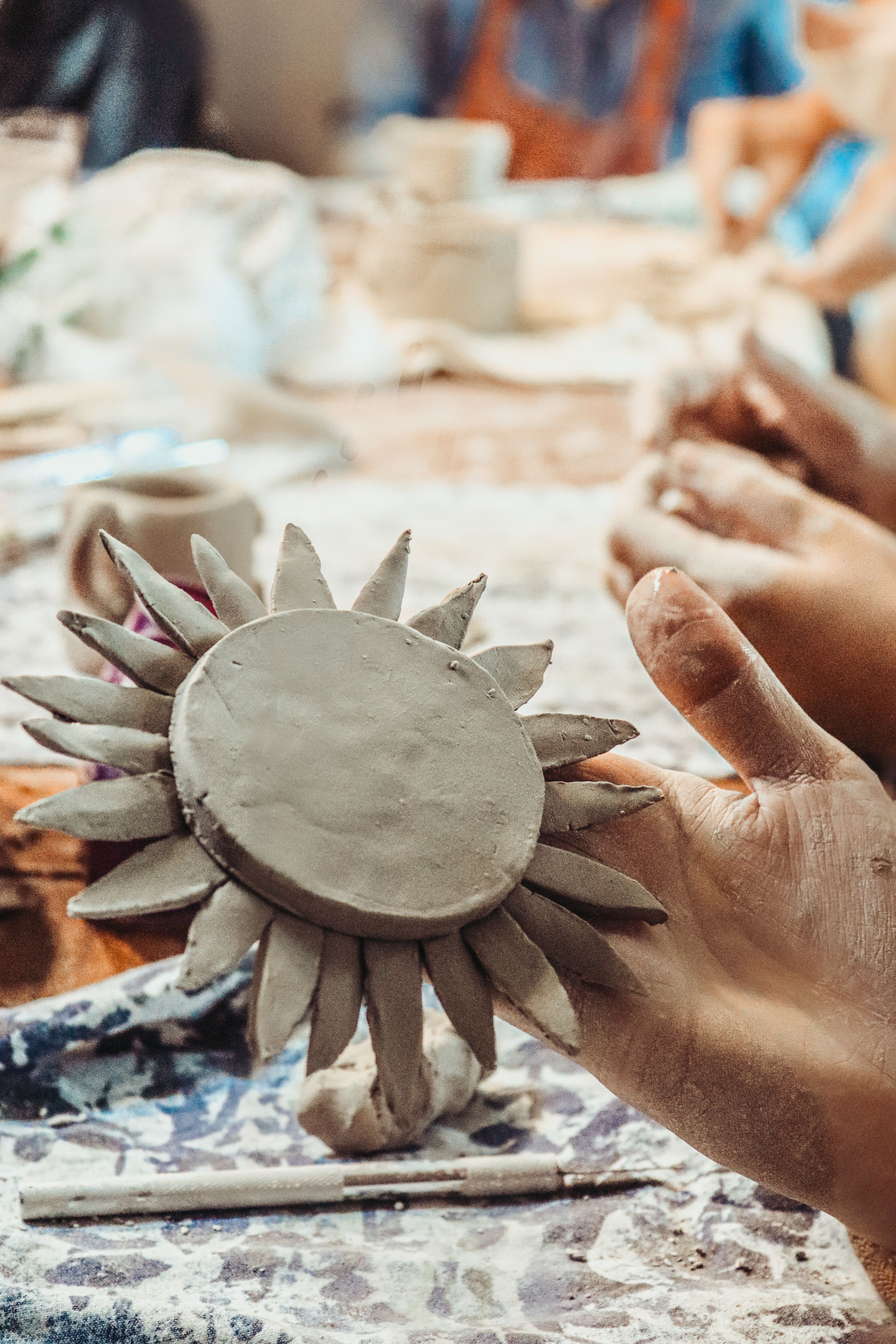 Handcrafted Clay Sun in Artisan's Workshop · Free Stock Photo