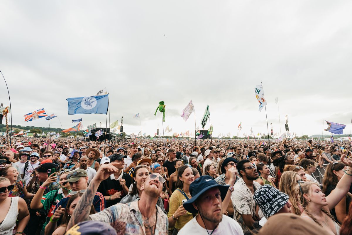 Security guard overseeing an outdoor event crowd