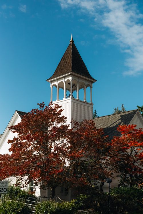 Free Picturesque view of a historic church with autumn foliage in Seattle, Washington. Stock Photo