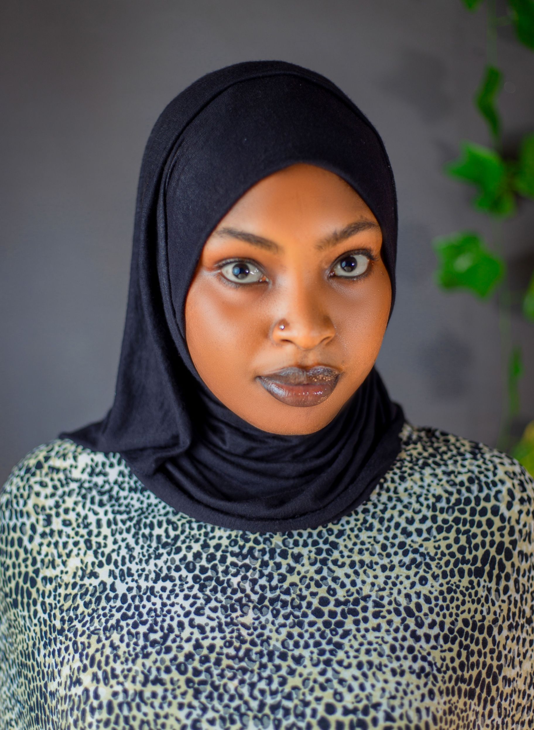 Woman with Hijab Posing Against Brown Background · Free Stock Photo