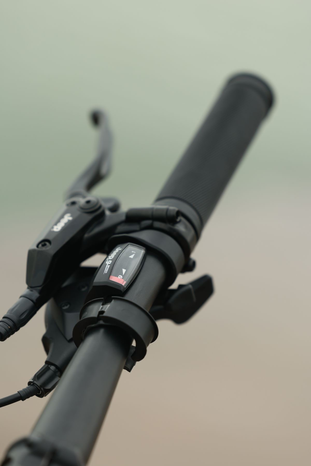 Close-up of a modern bicycle handlebar with controls