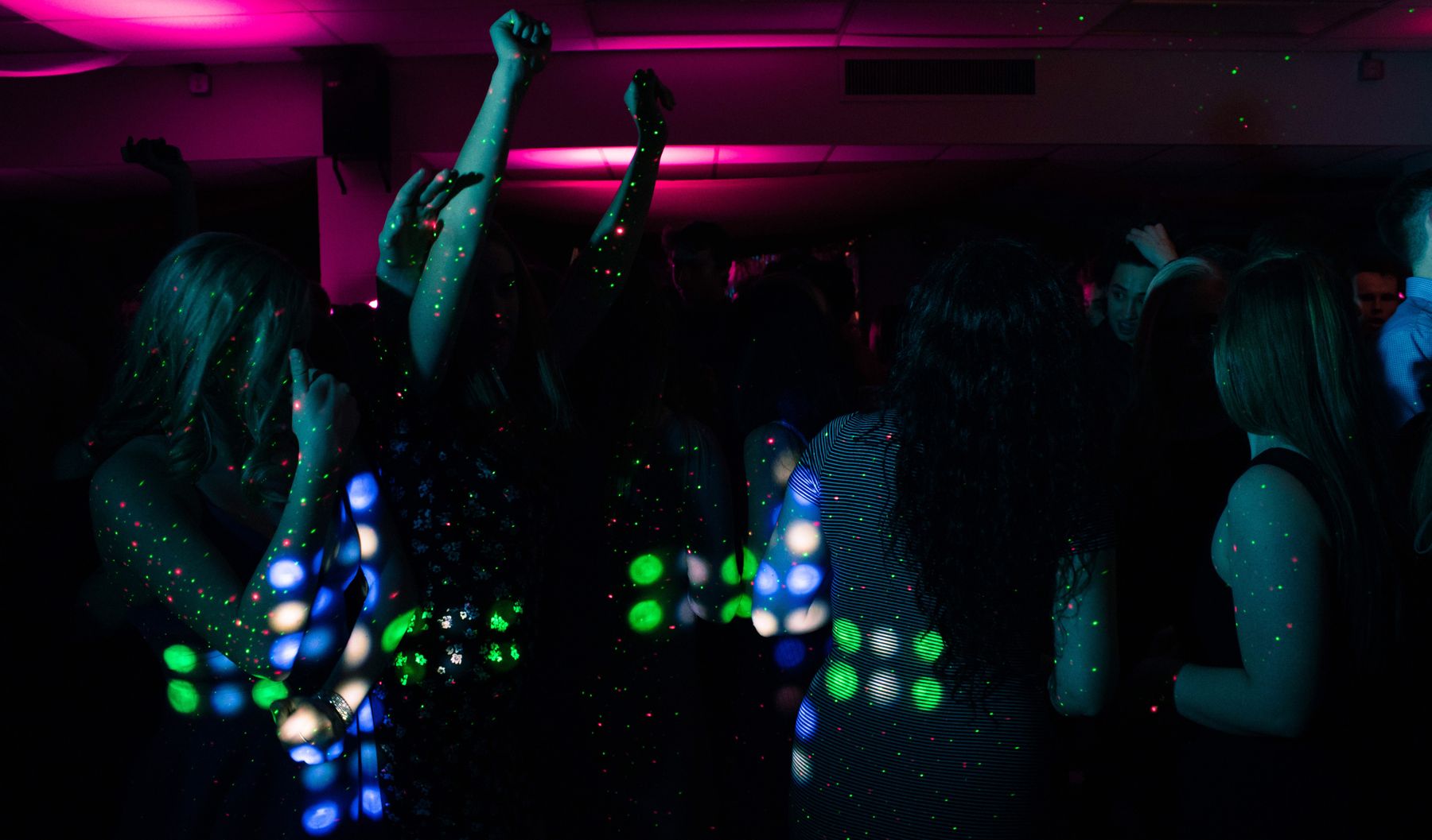 Crowd enjoying live music at a bar late at night