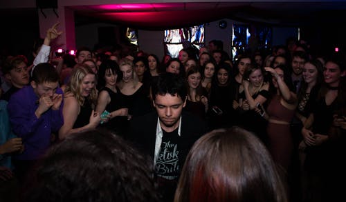 Man Standing in the Center of Crowd