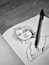 Artistic Sketch of a Woman with Pen on Paper