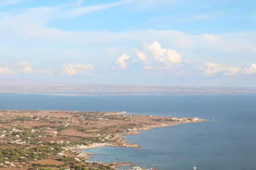 Free Scenic aerial view of Sicily's coastline under bright summer skies. Stock Photo