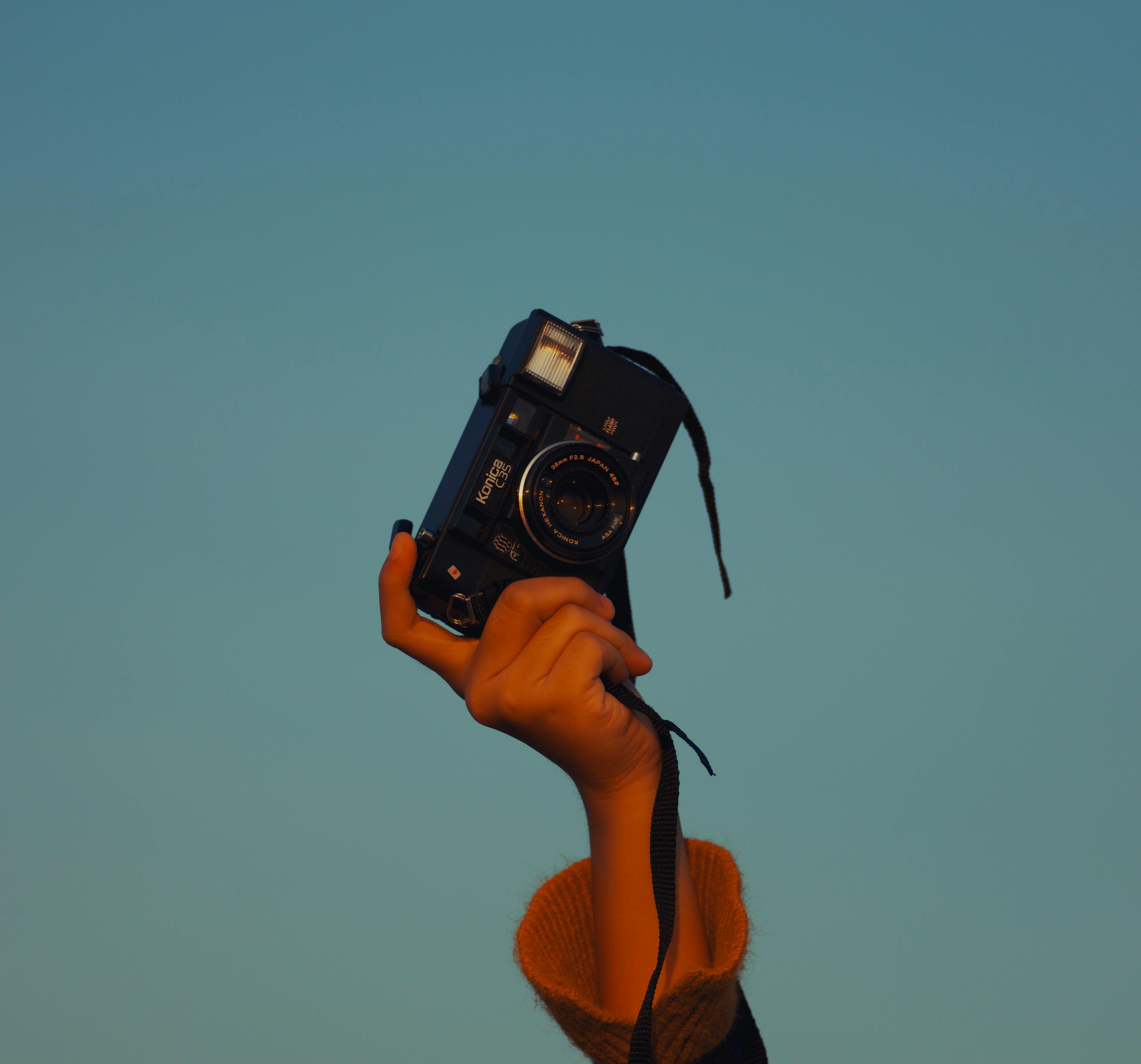 photo of person holding camera