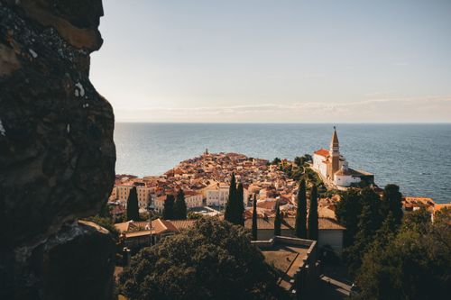 Free Aerial view of Piran, Slovenia's coastal town with historic architecture by the Adriatic Sea. Stock Photo