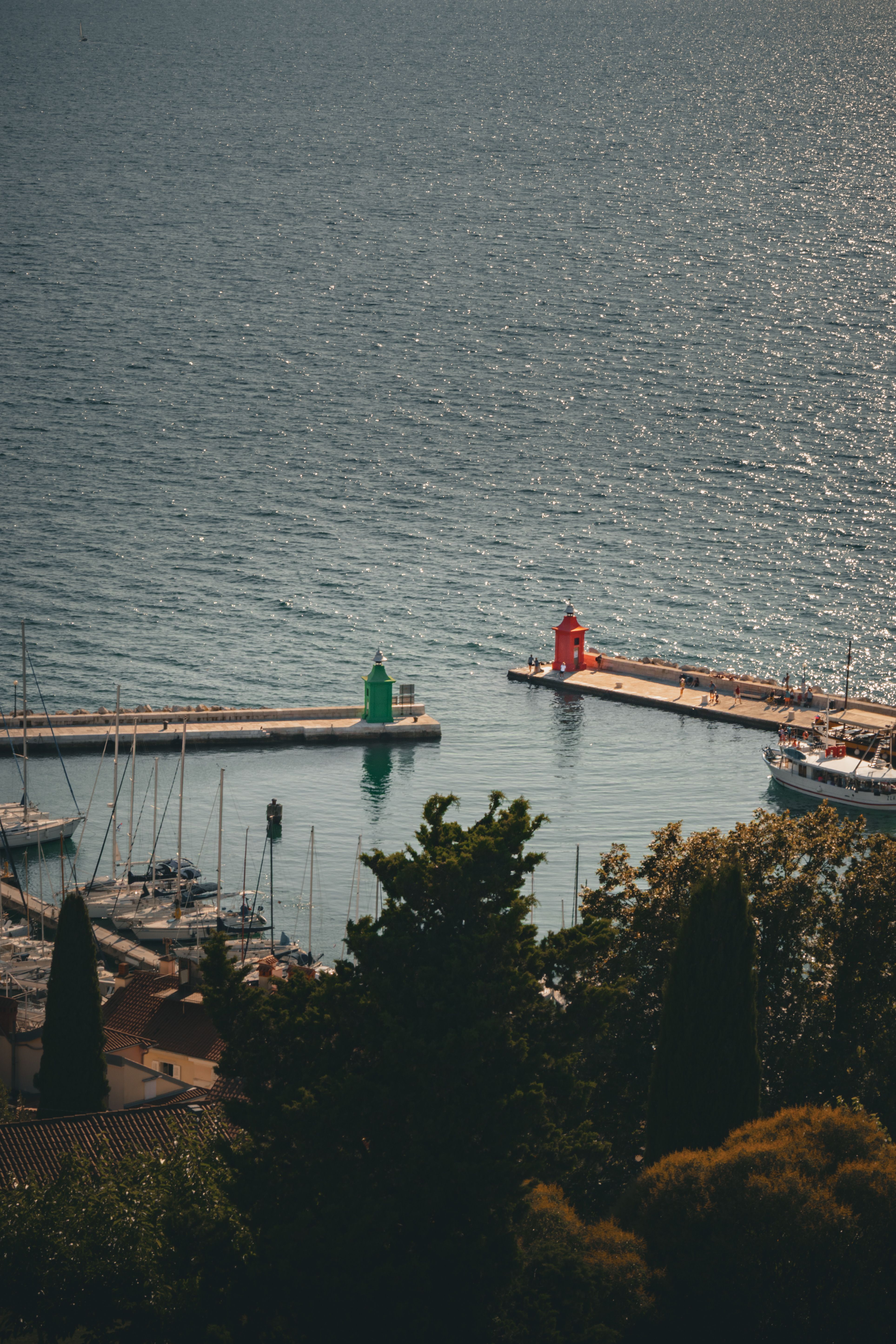 Scenic Aerial View of Serene Harbor with Lighthouses · Free Stock Photo