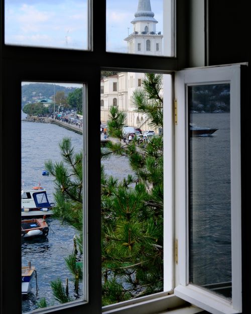 Free Tranquil view through a window of a river and historic architecture in Istanbul. Stock Photo