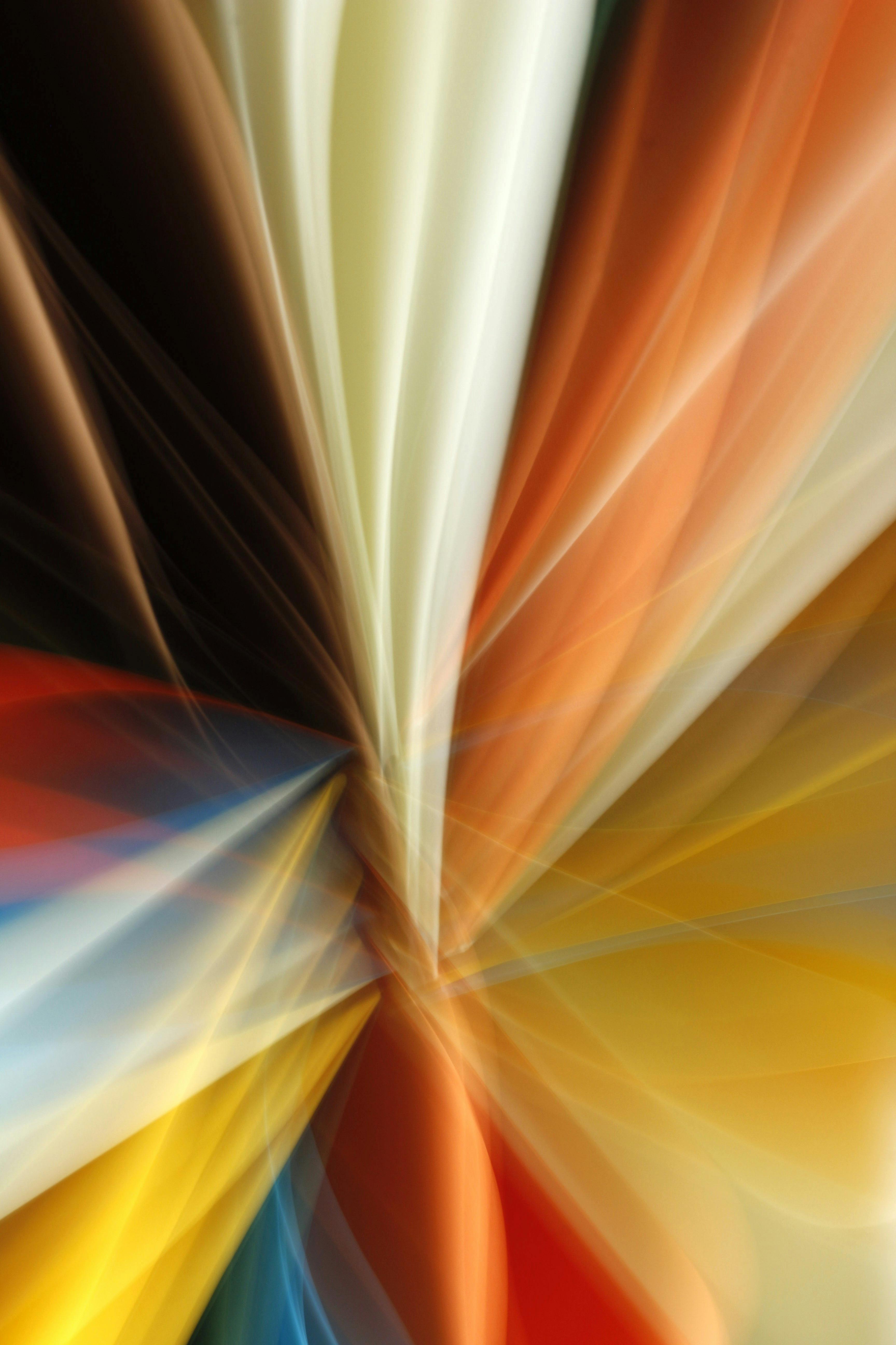 Dynamic abstract light patterns with vibrant colors creating an artistic visual effect.