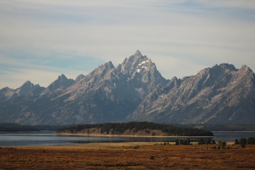 A breathtaking view of the Grand Teton mountains in Wyoming during the fall season.
