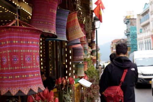 Free Street Vendor Display of Colorful Traditional Vietnamese Lanterns or Textiles Stock Photo