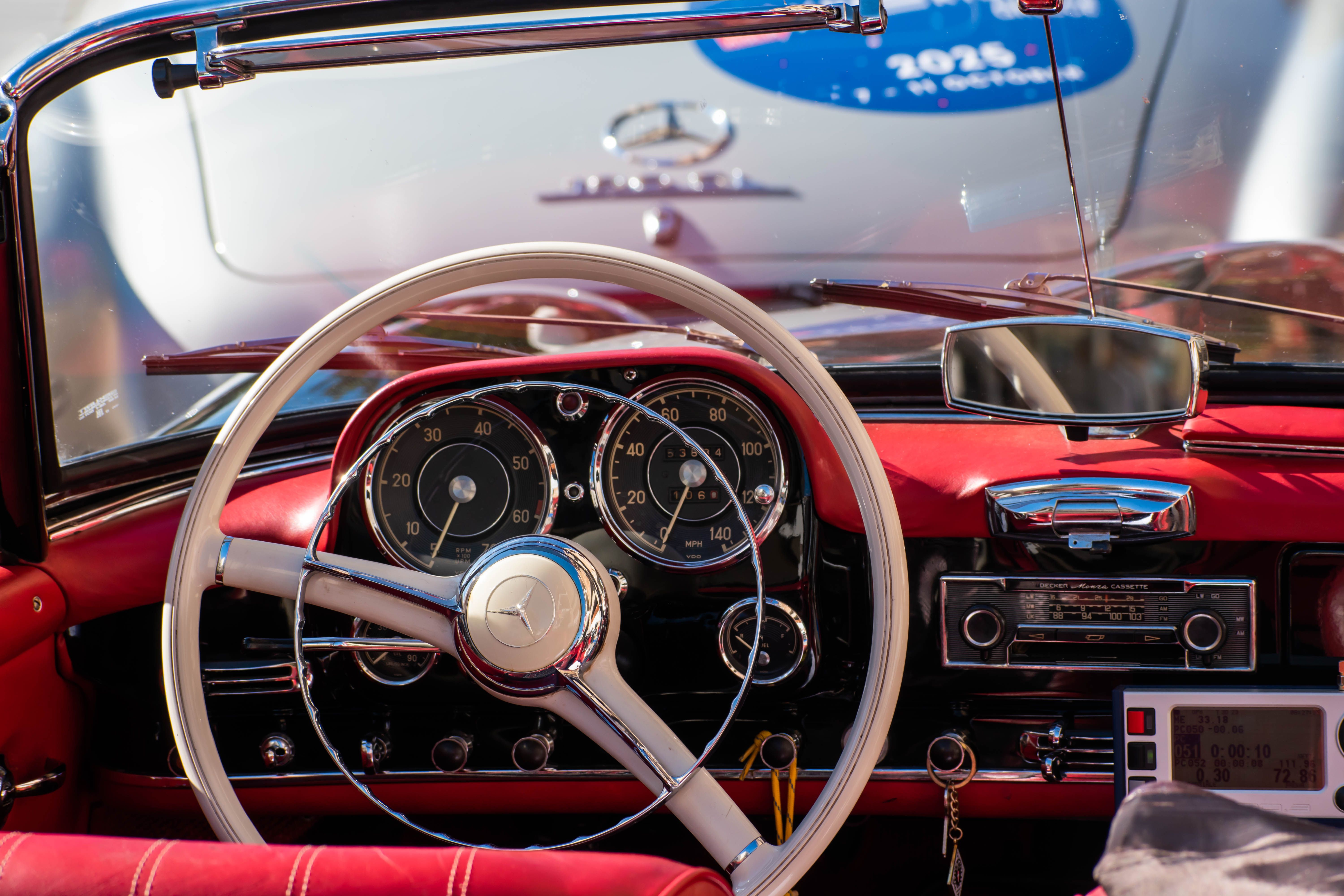 Red Classic Car in Dark Garage Setting · Free Stock Photo