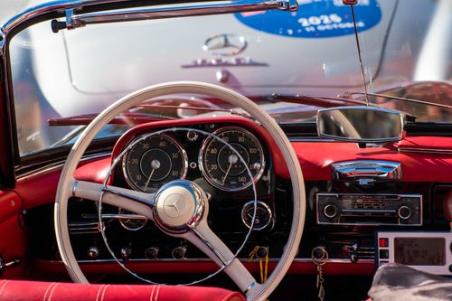 Red Classic Car in Dark Garage Setting · Free Stock Photo