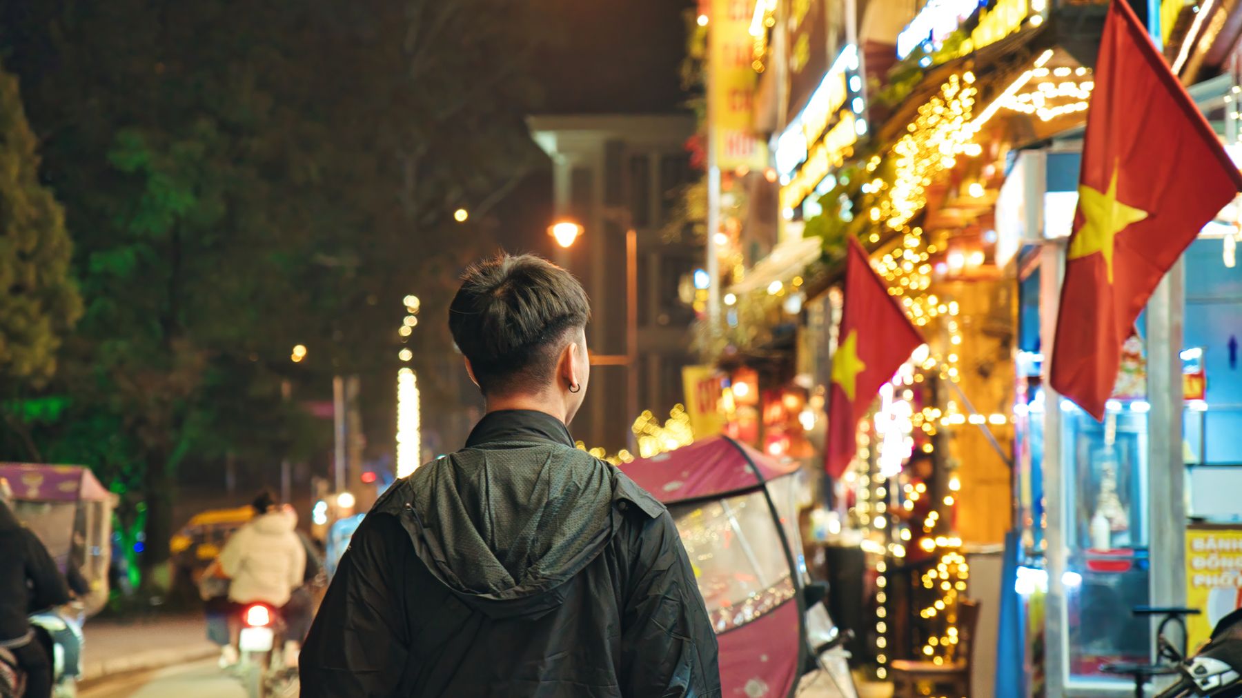 Explore the vibrant nightlife in Lao Cai, Vietnam with bustling streets and lively neon lights.