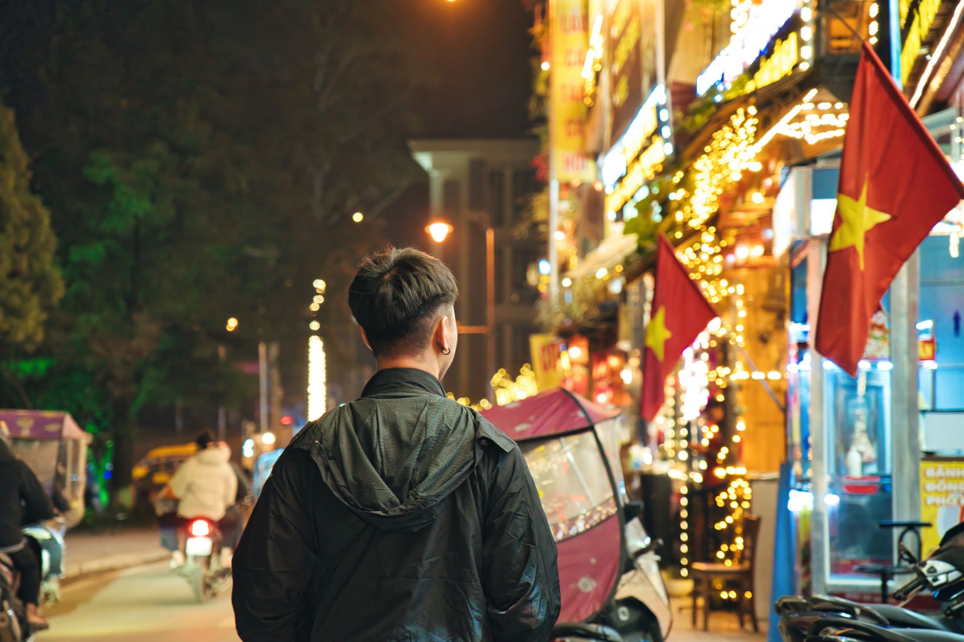 Explore the vibrant nightlife in Lao Cai, Vietnam with bustling streets and lively neon lights.