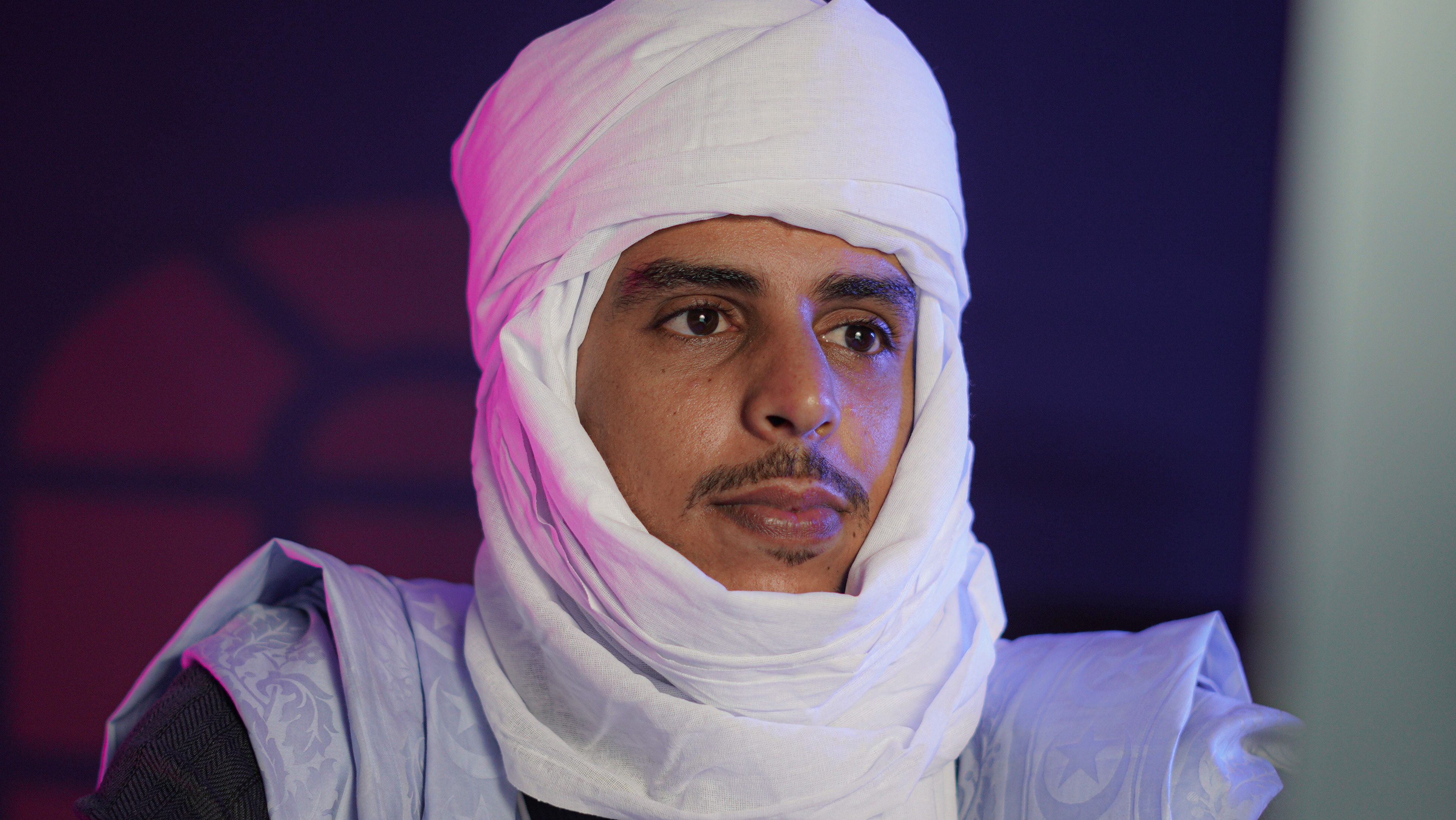 Portrait of a Man in Traditional White Turban