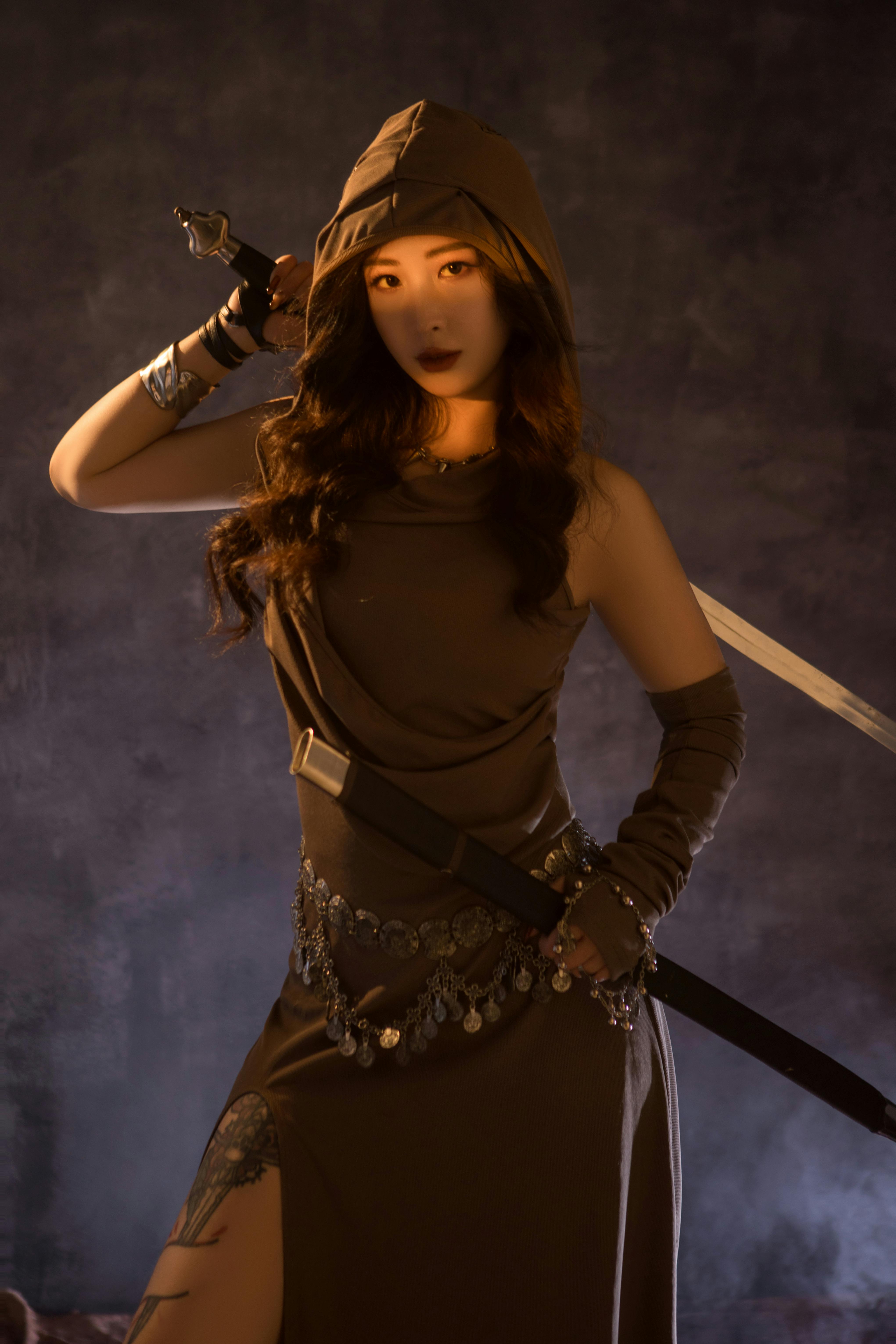 Mysterious Warrior Woman in Hooded Costume