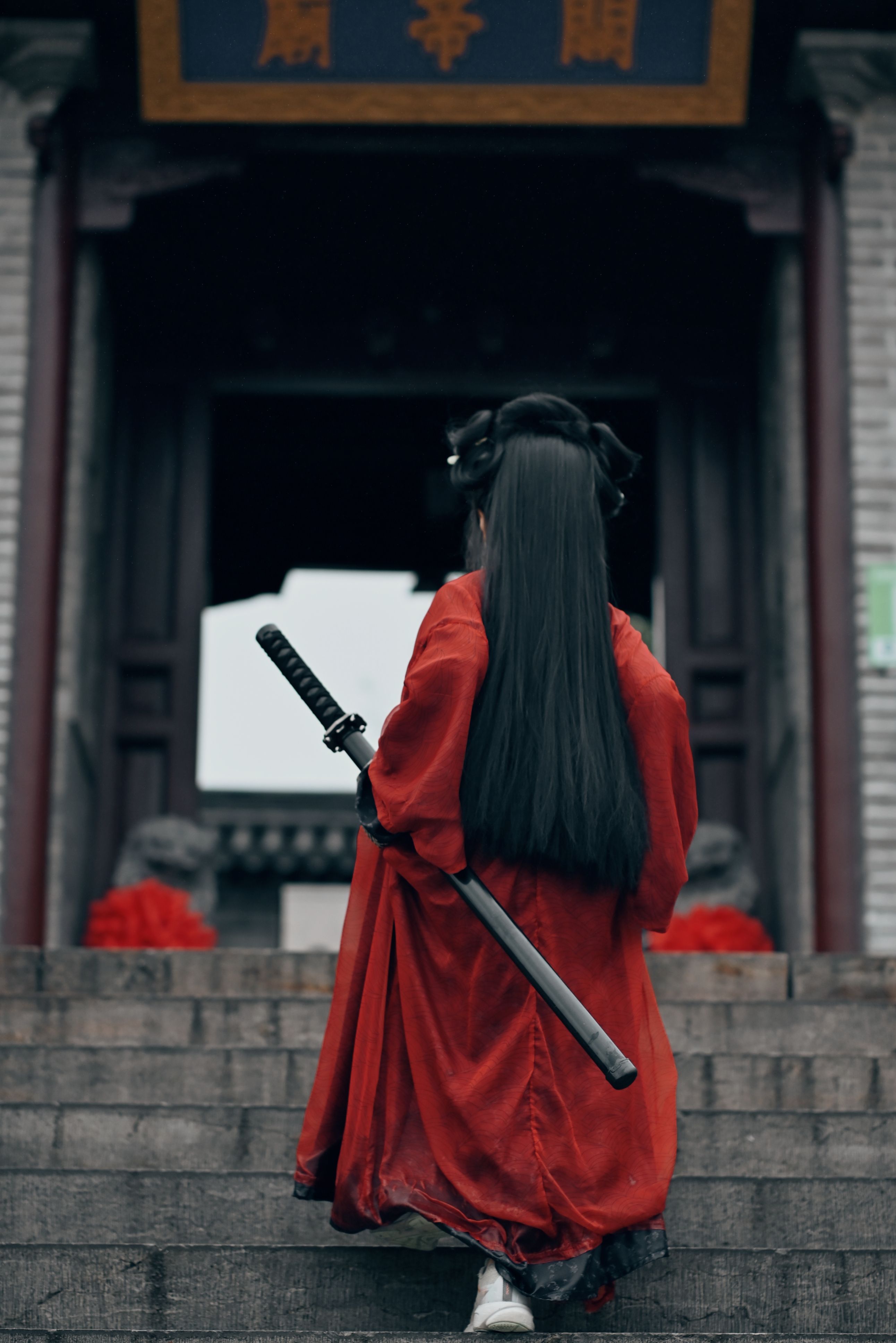 Traditional Samurai in Red Robe Ascending Stairs · Free Stock Photo