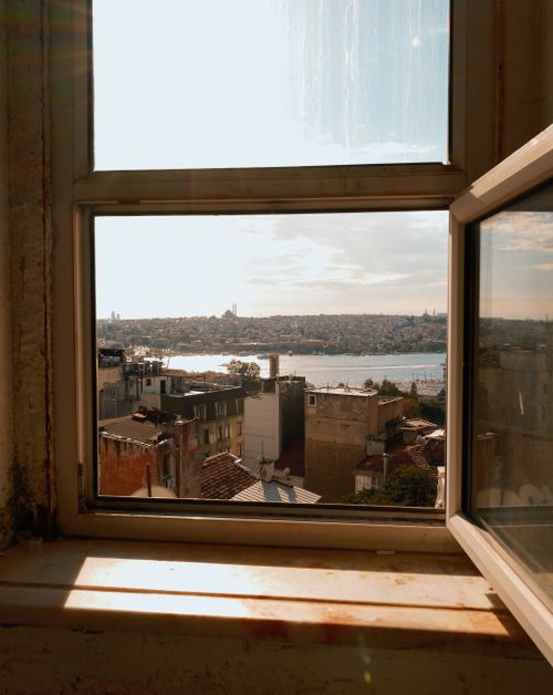 Free Captivating view of Istanbul cityscape and Bosphorus from a window on a sunny day. Stock Photo