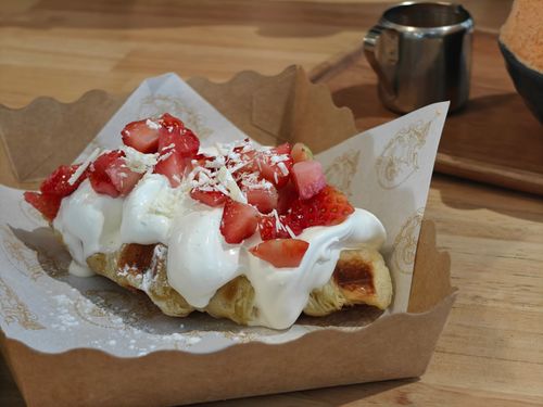 Free Croffle Topped with Whipped Cream and Fresh Strawberries Stock Photo