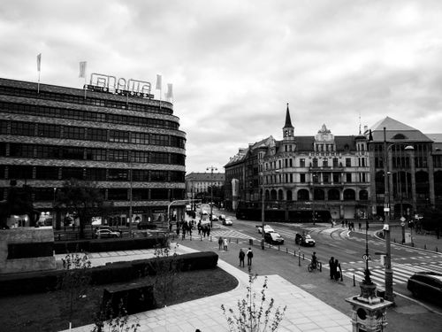 Free Urban cityscape in black and white featuring historic architecture and a busy street. Stock Photo