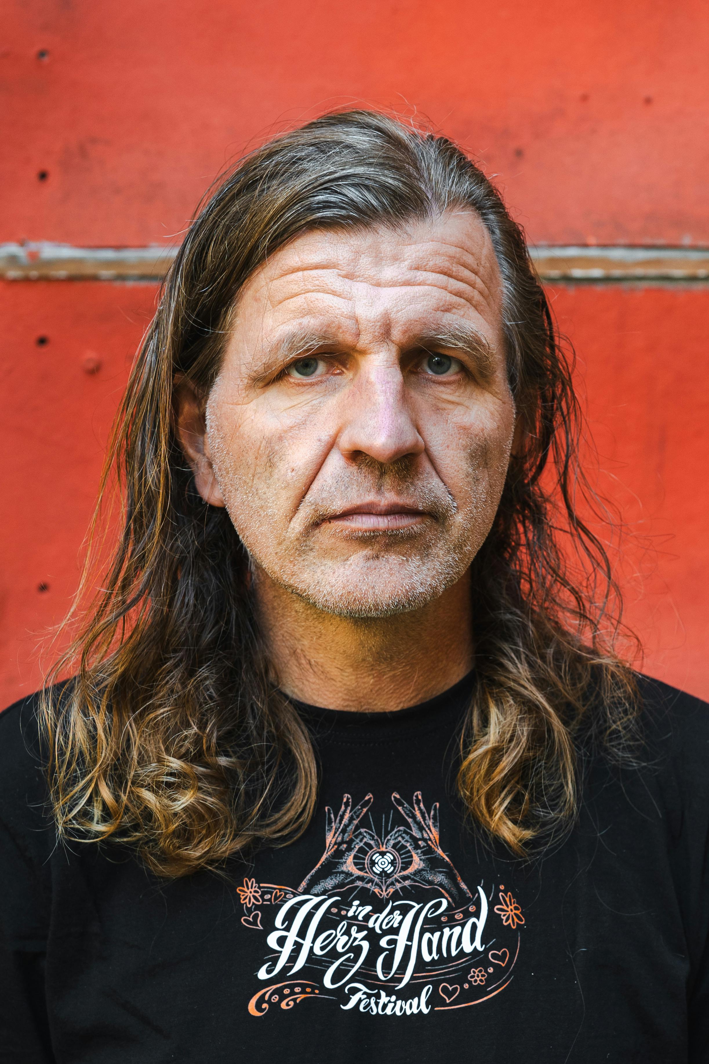 Expressive portrait of an adult man in Görlitz, Germany, showcasing natural features.