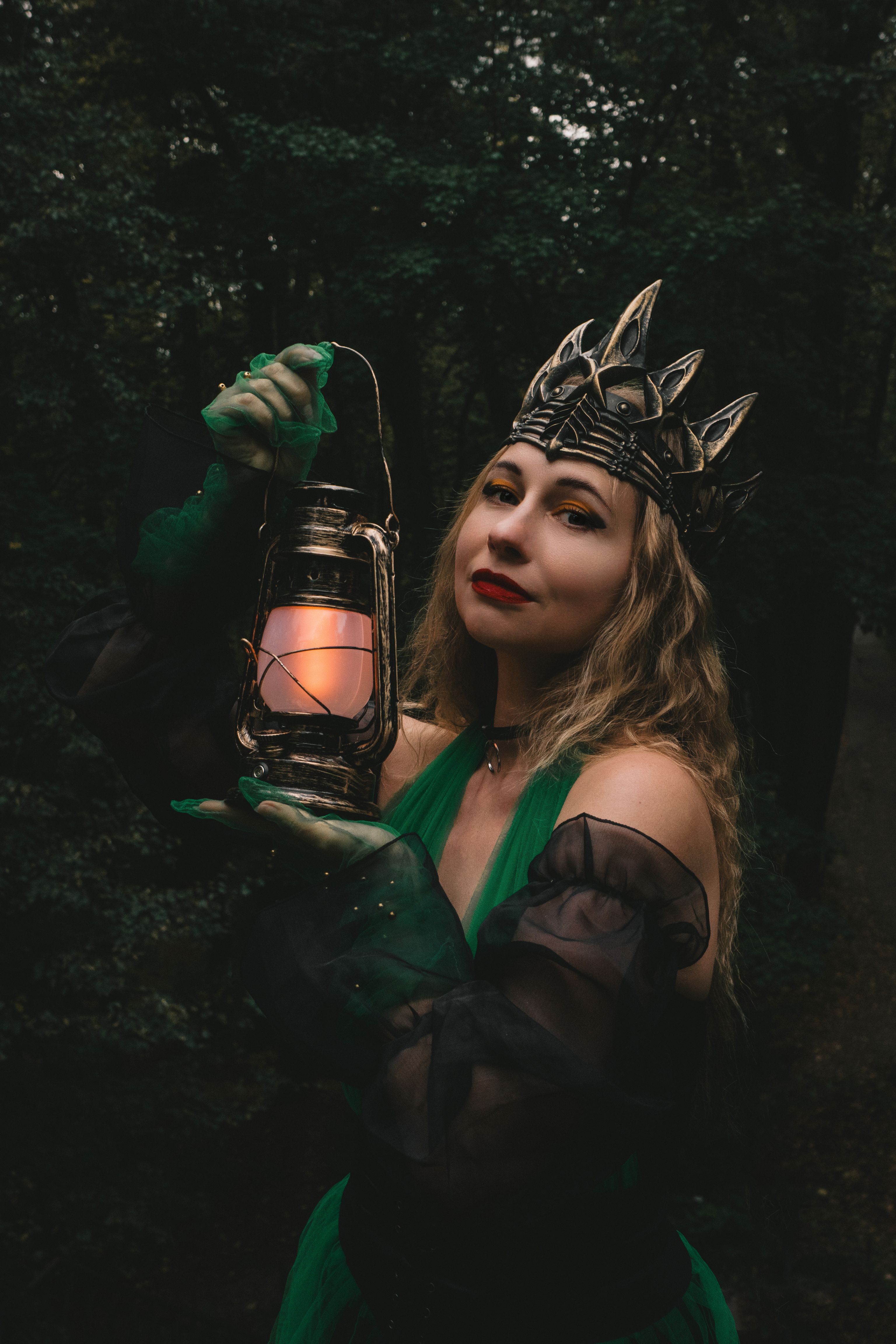 Mysterious Woman in Gothic Green Dress Holding Lantern  Free Stock Photo