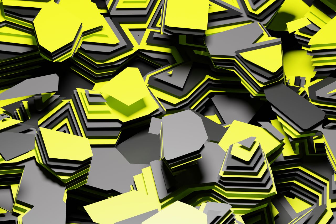dynamic abstract image of layered yellow and gray shapes creating a vi