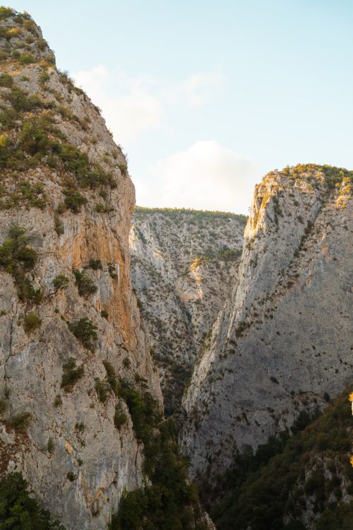 Free Stunning view of a rocky canyon illuminated by the warm glow of sunset, showcasing natural beauty. Stock Photo