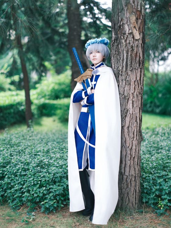Sword Robe Cosplayer in blue robe with sword outdoors · Free Stock Photo