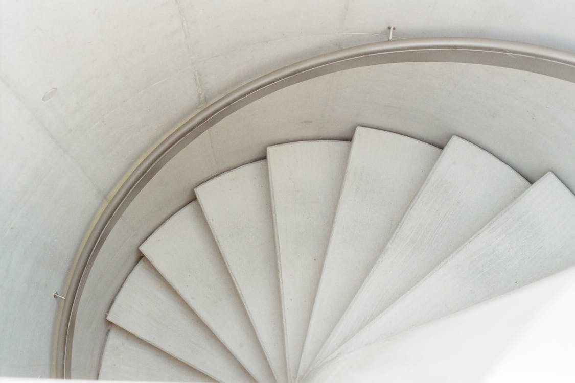 Free High Angle Photo of White Spiral Staircase Stock Photo
