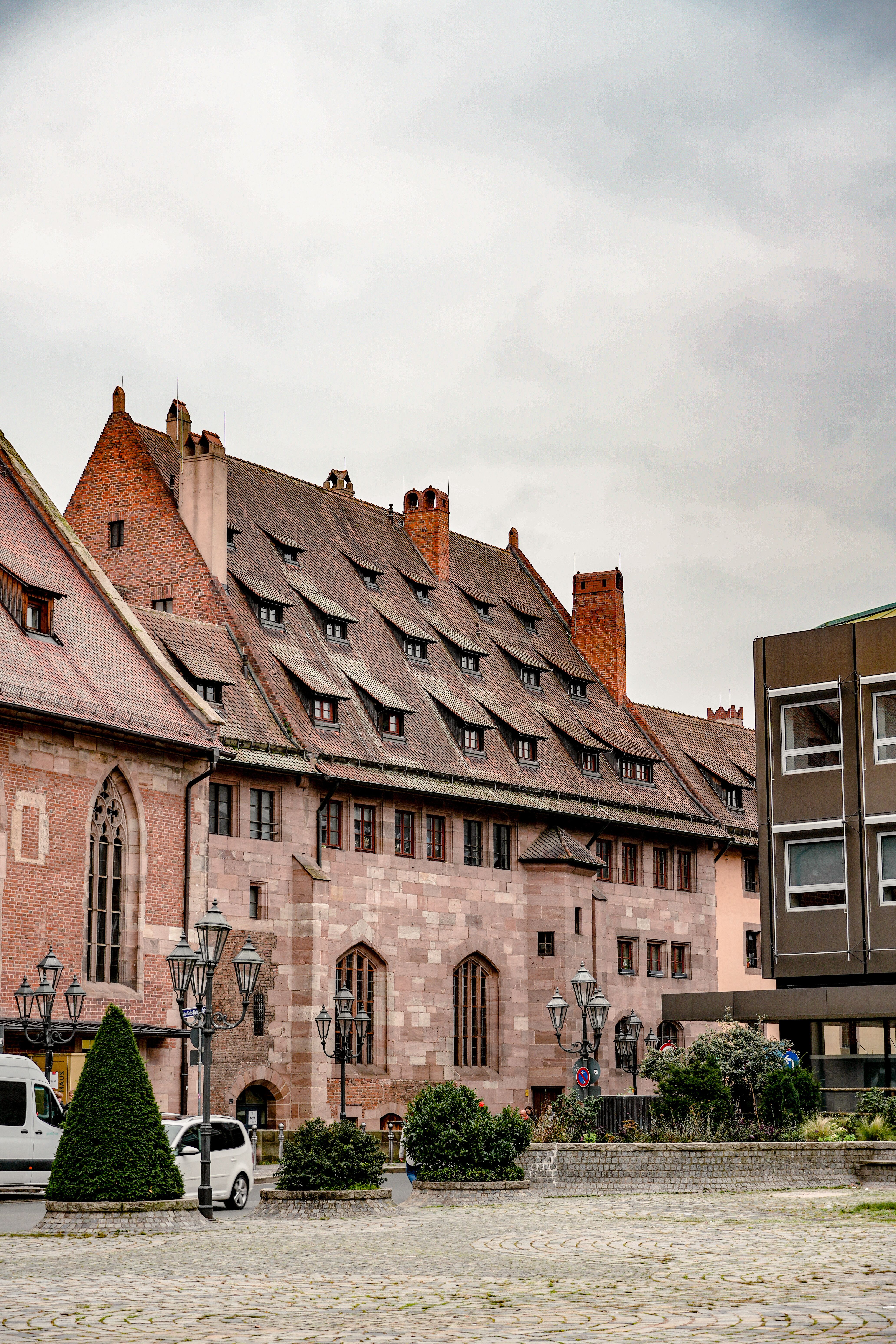 Charming old European building in a city square, showcasing gothic architecture.