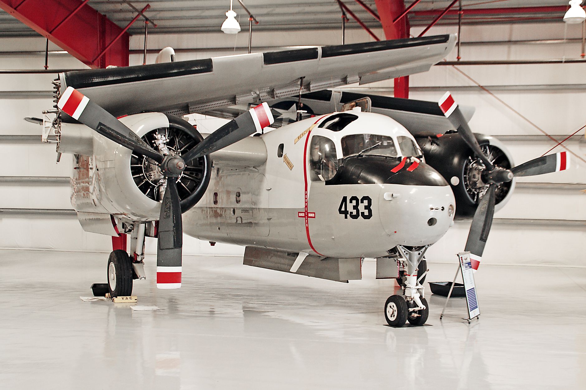A restored S2-F Tracker aircraft displayed indoors at a museum in Titusville, Florida.