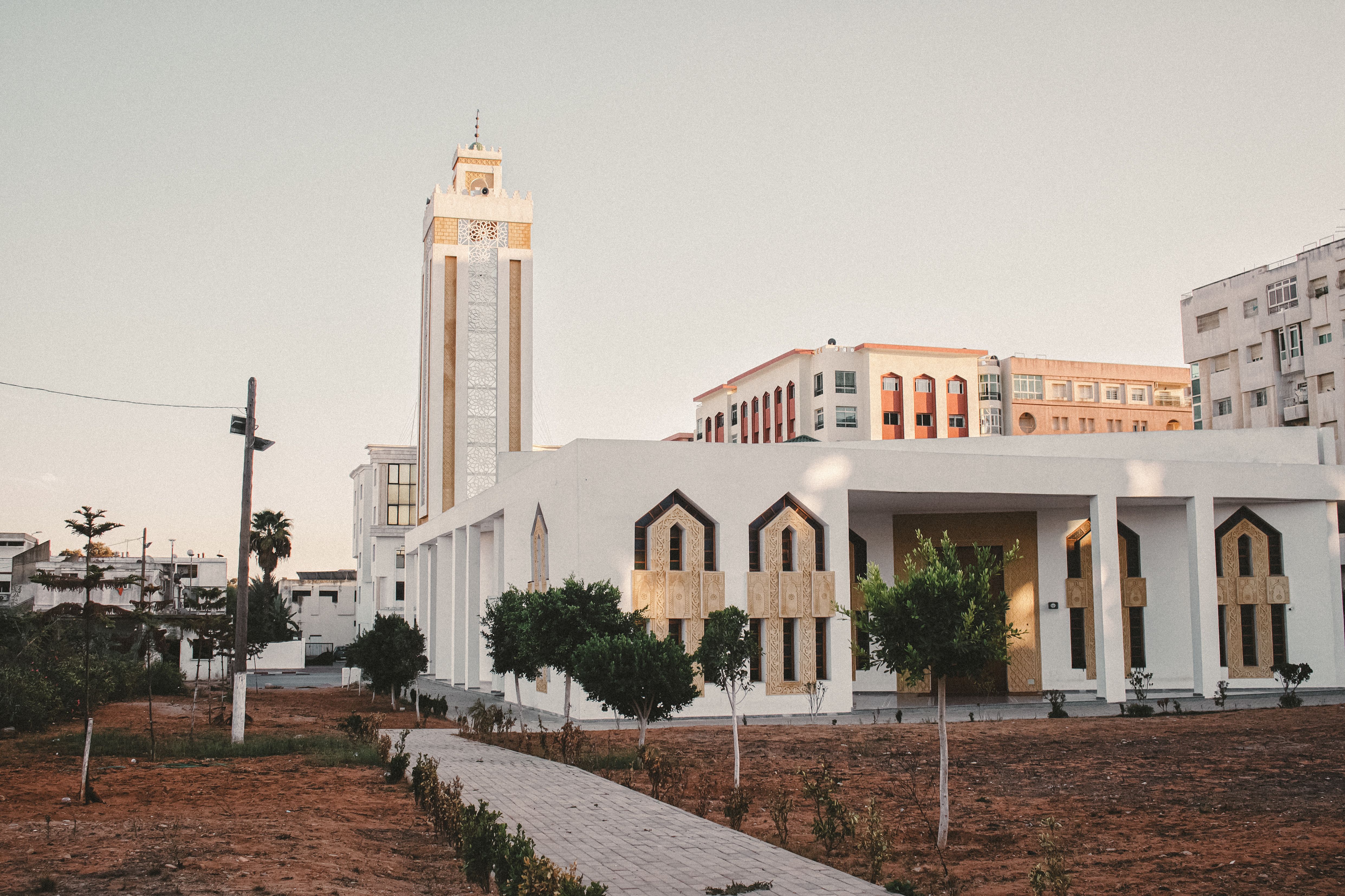 Beautiful modern architecture at sunset in Kenitra, Morocco, showcasing intricate design elements.