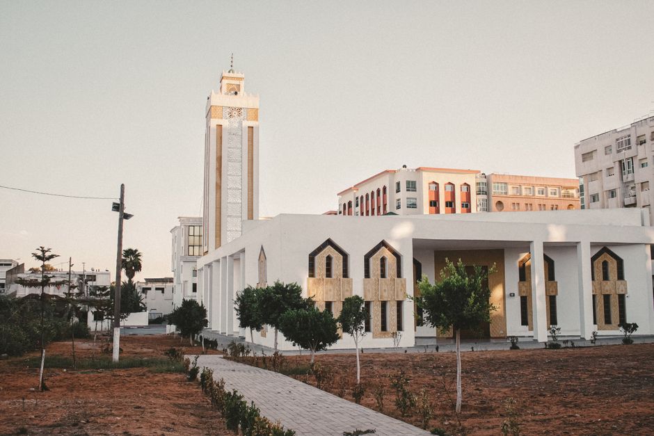 Beautiful modern architecture at sunset in Kenitra, Morocco, showcasing intricate design elements.