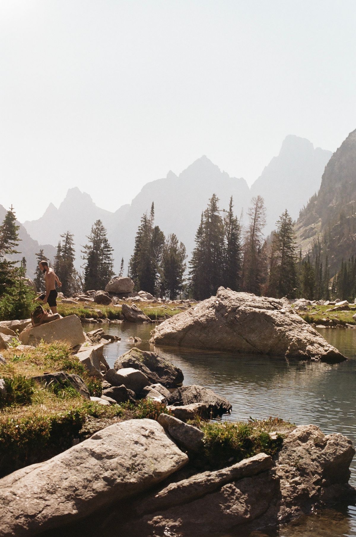 Scenic Mountain Lake View with Hikers in Summer