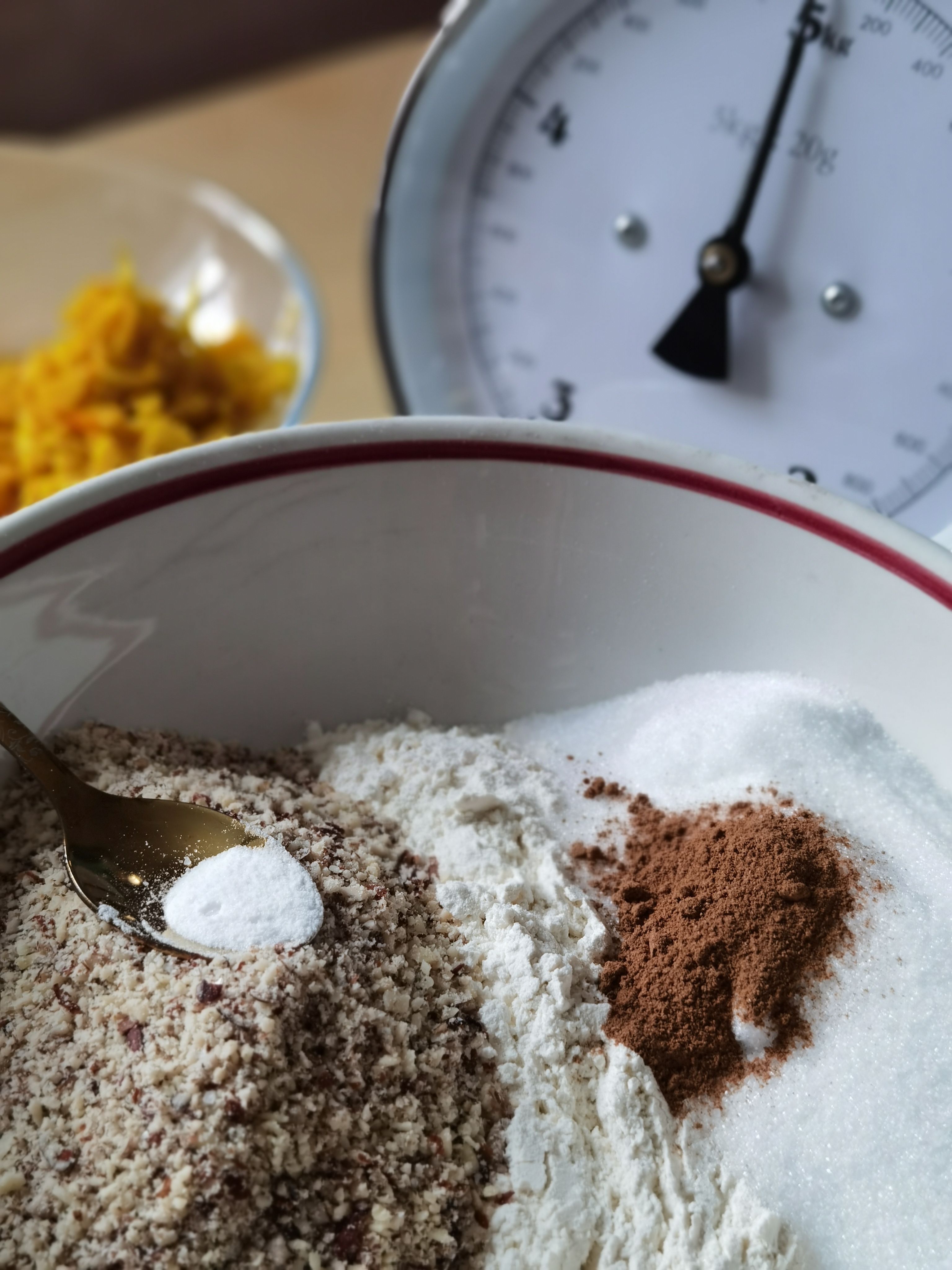 Close-up of baking ingredients with a vintage kitchen scale, perfect for a recipe blog.