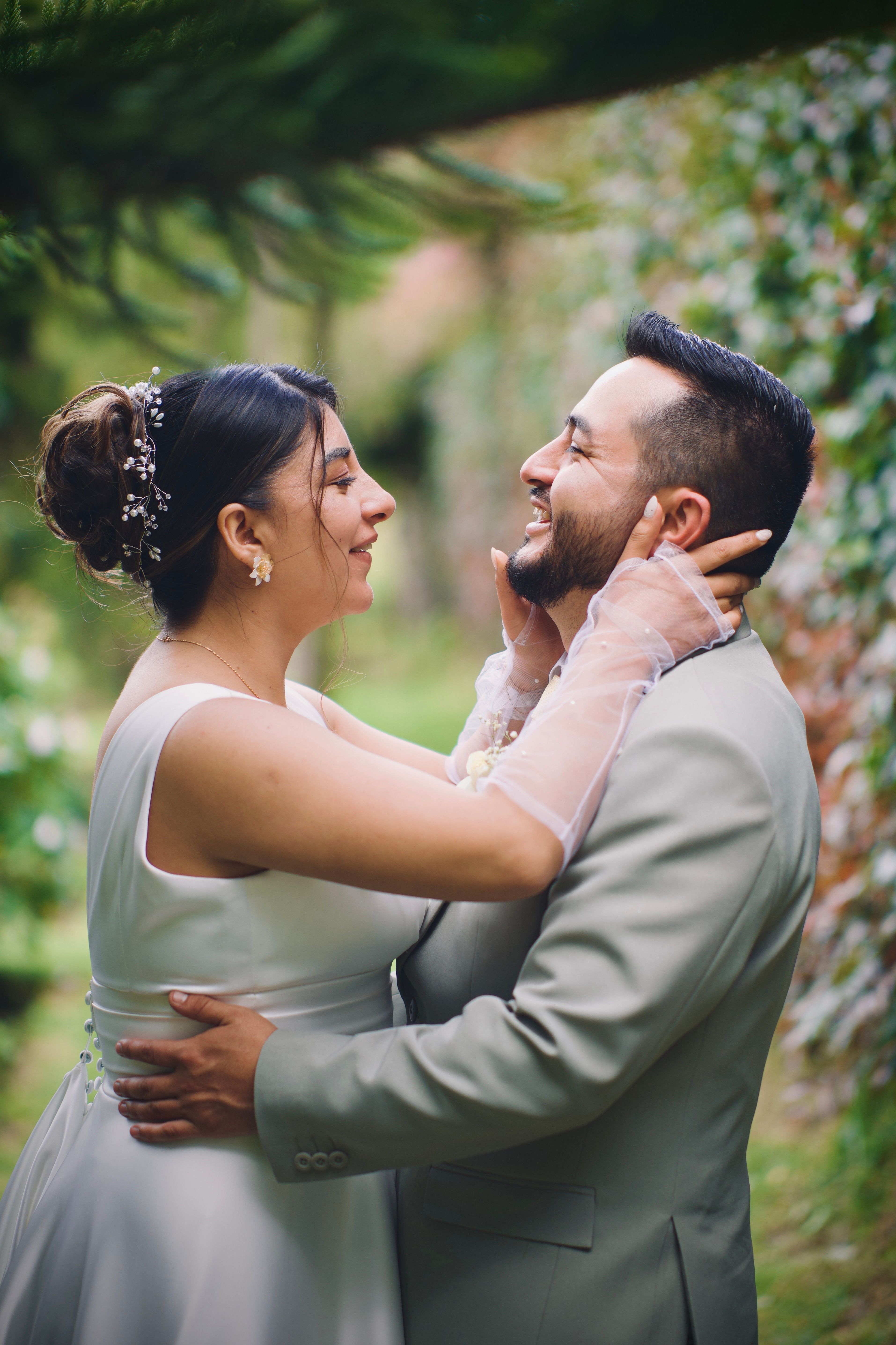 Romantic Wedding Couple Embracing Outdoors · Free Stock Photo