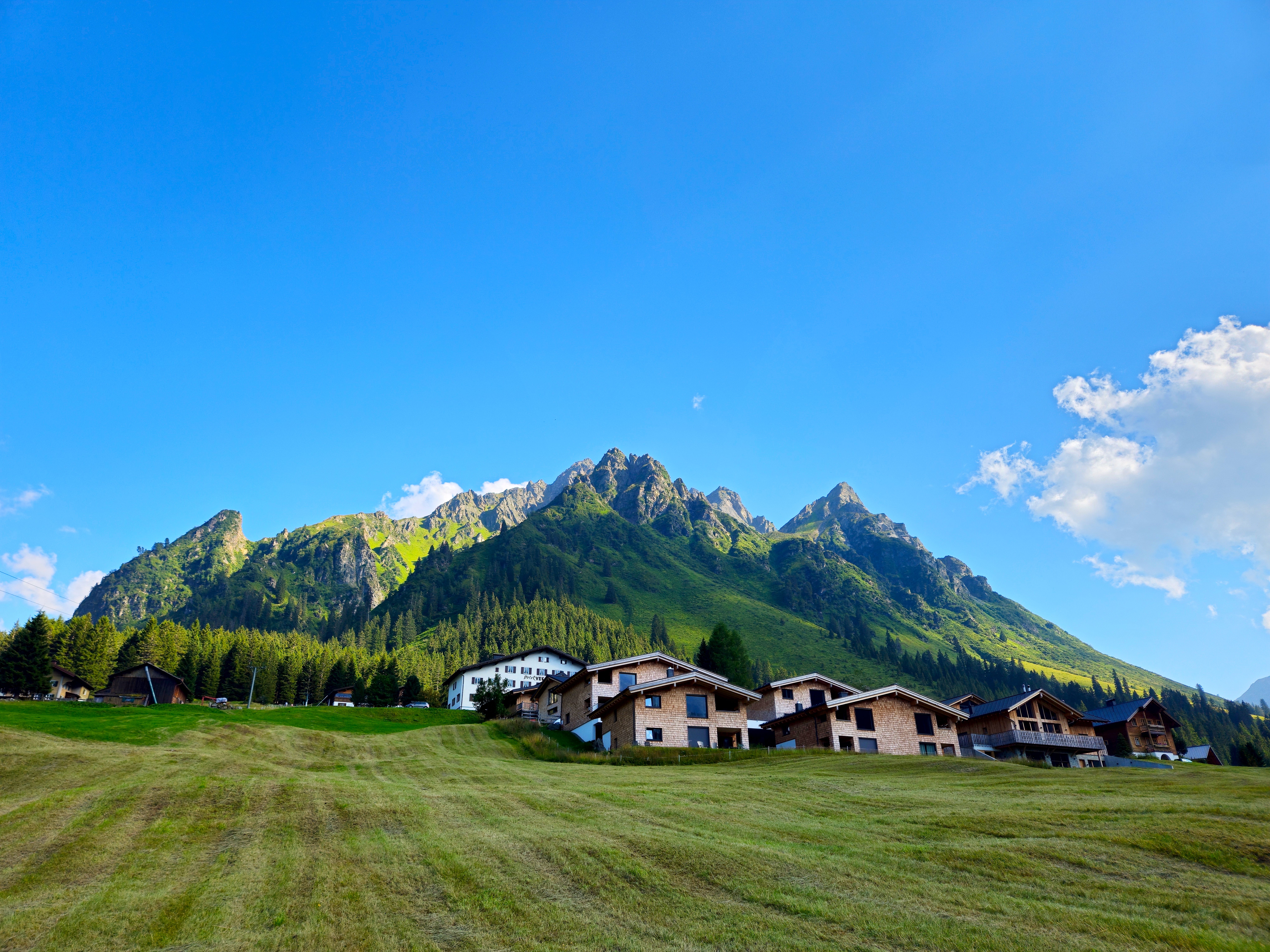 Breathtaking view of the Vorarlberg mountains and alpine village in Austria during summer.