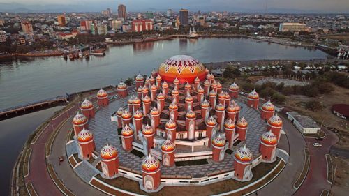 Free Aerial Shot The 99 Domes Mosque with City View and Losari Beach Background Stock Photo