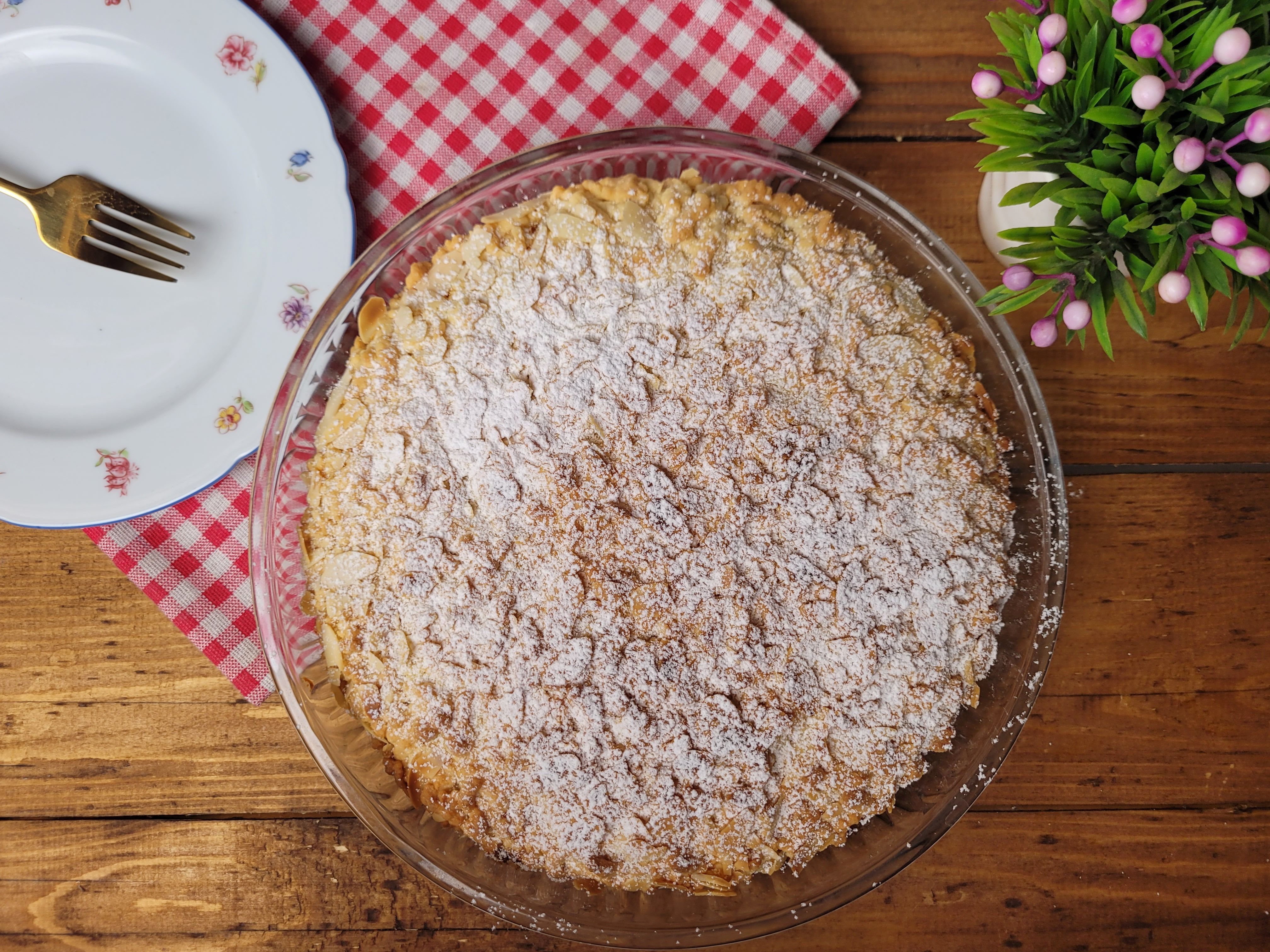 Finished apple crumble pie with a golden topping, flavoured with cinnamon & vanilla