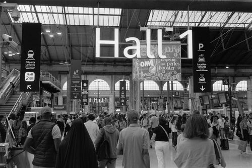 Free Crowded Gare du Nord in Paris, bustling with travelers in Hall 1. Iconic French station. Stock Photo