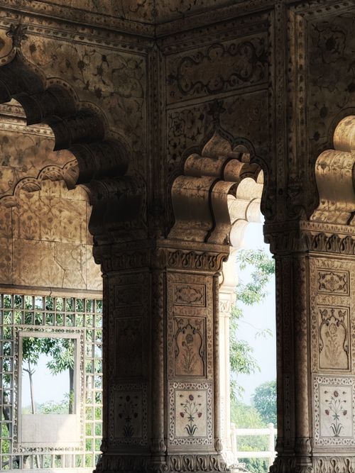 Free Discover the ornate carvings and arches of a historic Mughal pavilion, showcasing intricate craftsmanship. Stock Photo