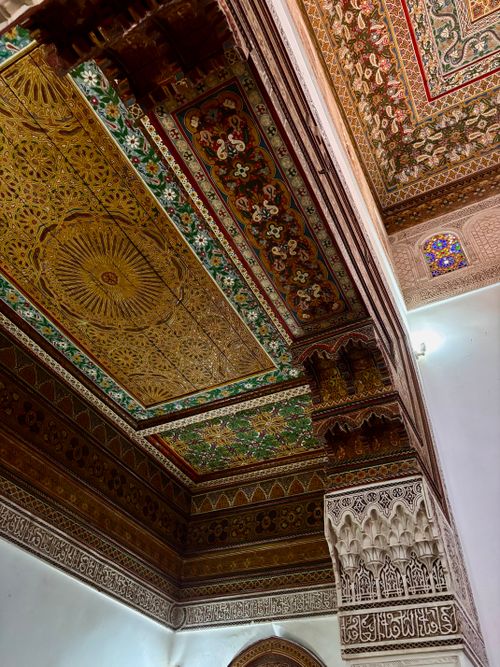 Free Beautifully detailed Moroccan ceiling showcasing traditional geometric and floral patterns. Stock Photo